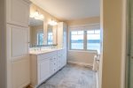 Large Master bath with shower, double sink, and windows overlooking Keuka Lake